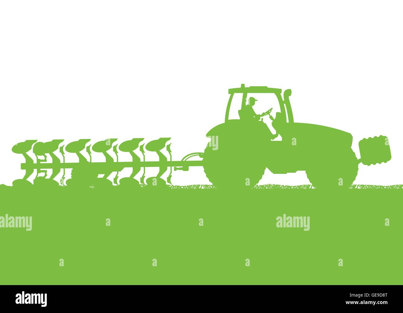Agriculture tractor plowing the land in cultivated country grain field ...