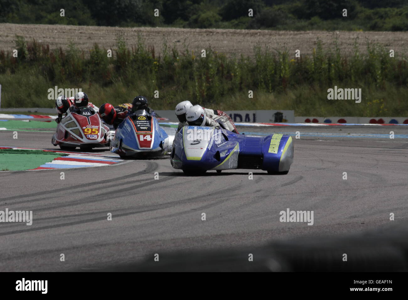 Rob Biggs/Ben Ransley, Alan Founds/Aki Alto and Lewis Blackstock/Patrick Rosney. riding in the qualifying rounds of the Hyundai Heavy Industries British Sidecars at Thruxton 23 July 2016. Stock Photo