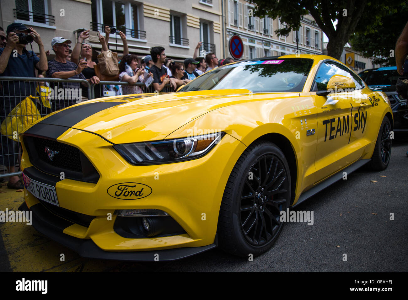 24th July, 2016. Chantilly, FR. Team Sky introduced a yellow painted version of one of their team cars, a Ford Mustang GT, in celebration of Chris Froome's overall victory. John Kavouris/Alamy Live News Stock Photo