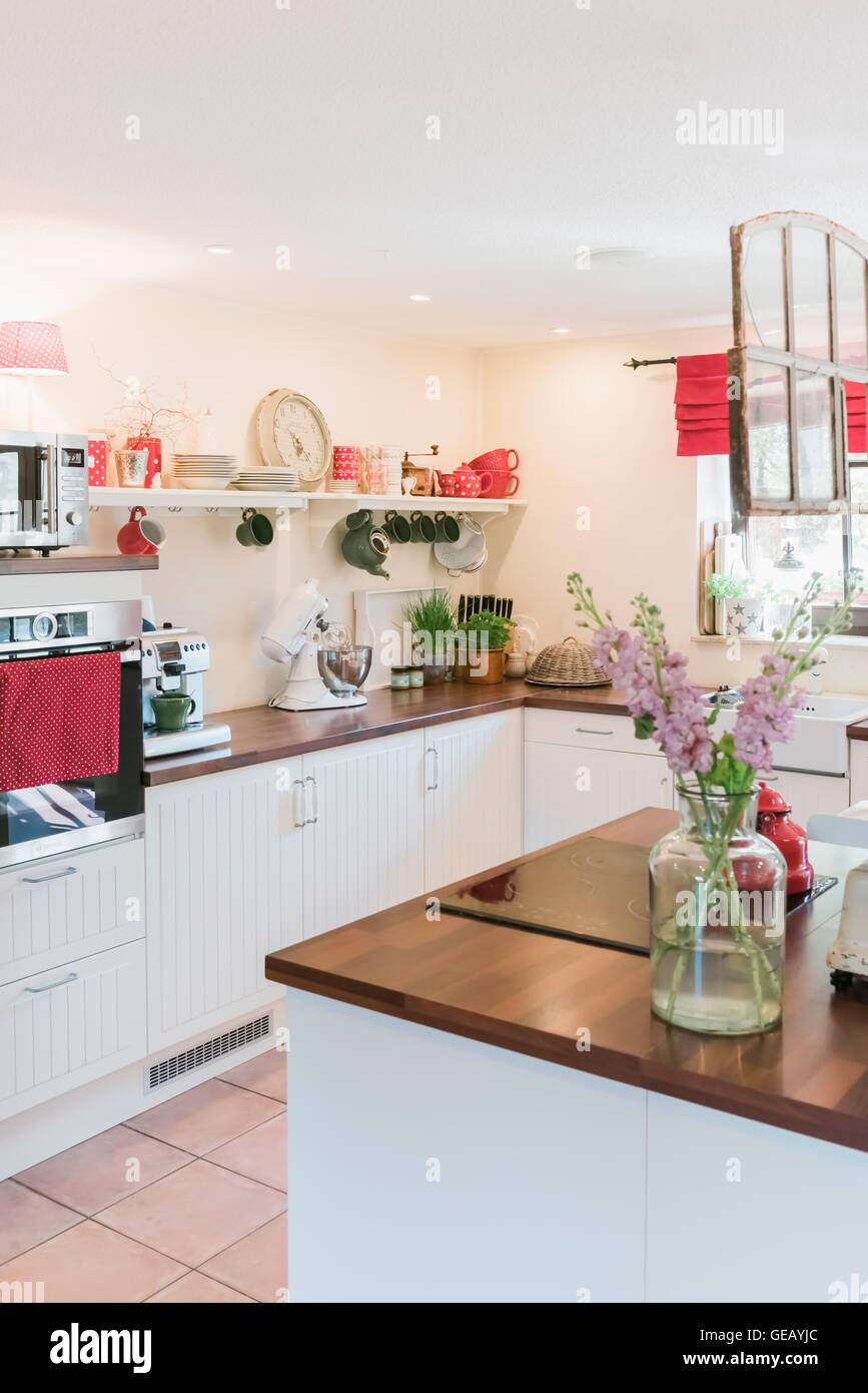 Kitchen with flowers on kitchen island Stock Photo Alamy