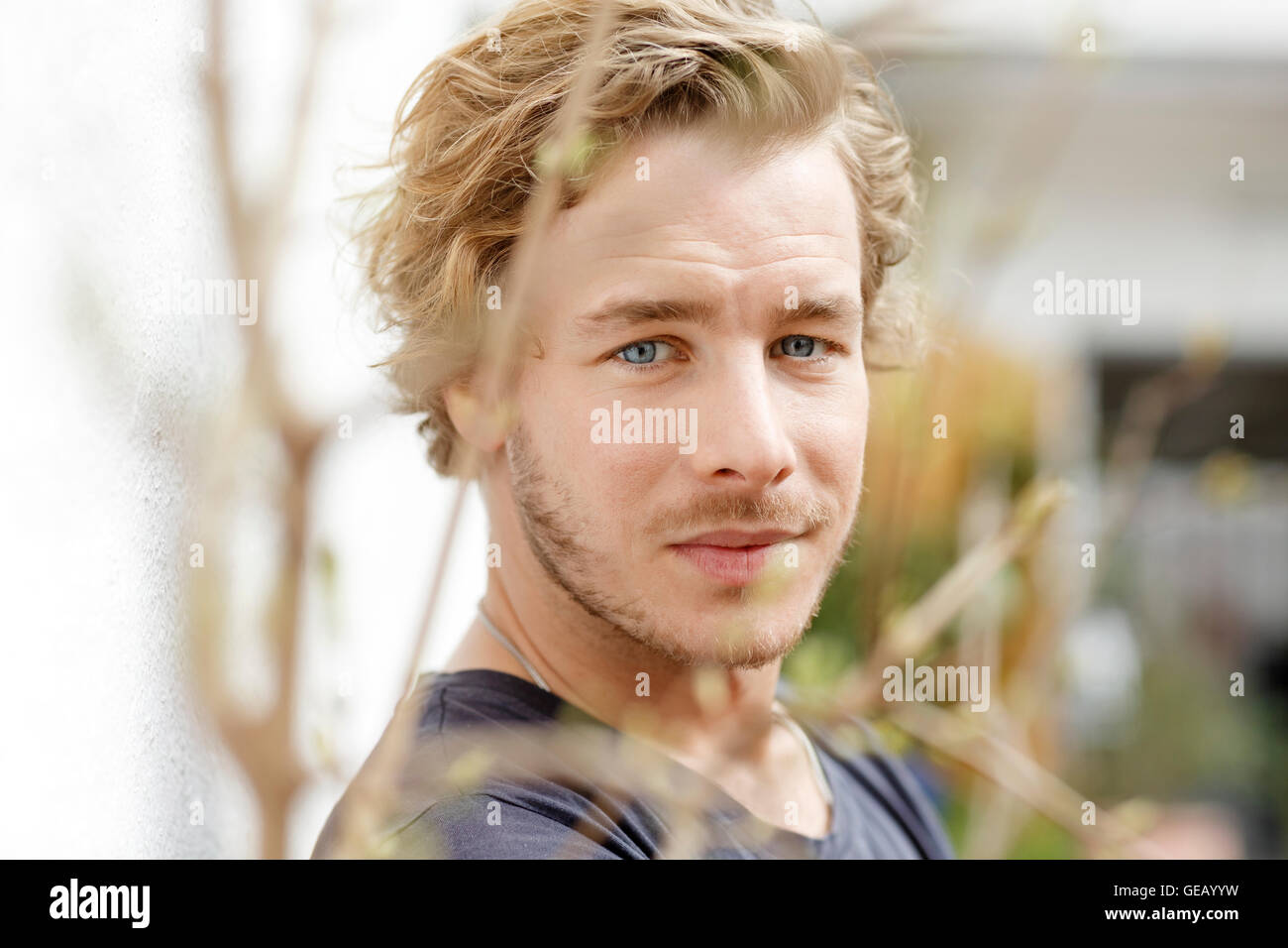 Portrait of a blond young man Stock Photo - Alamy
