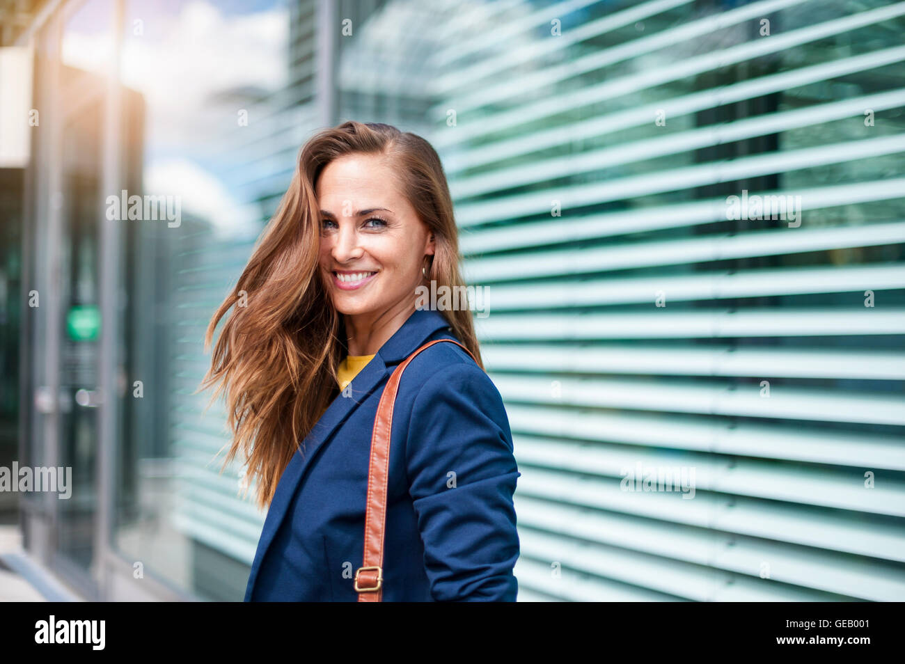 Portrait of smiling brunette woman Stock Photo - Alamy