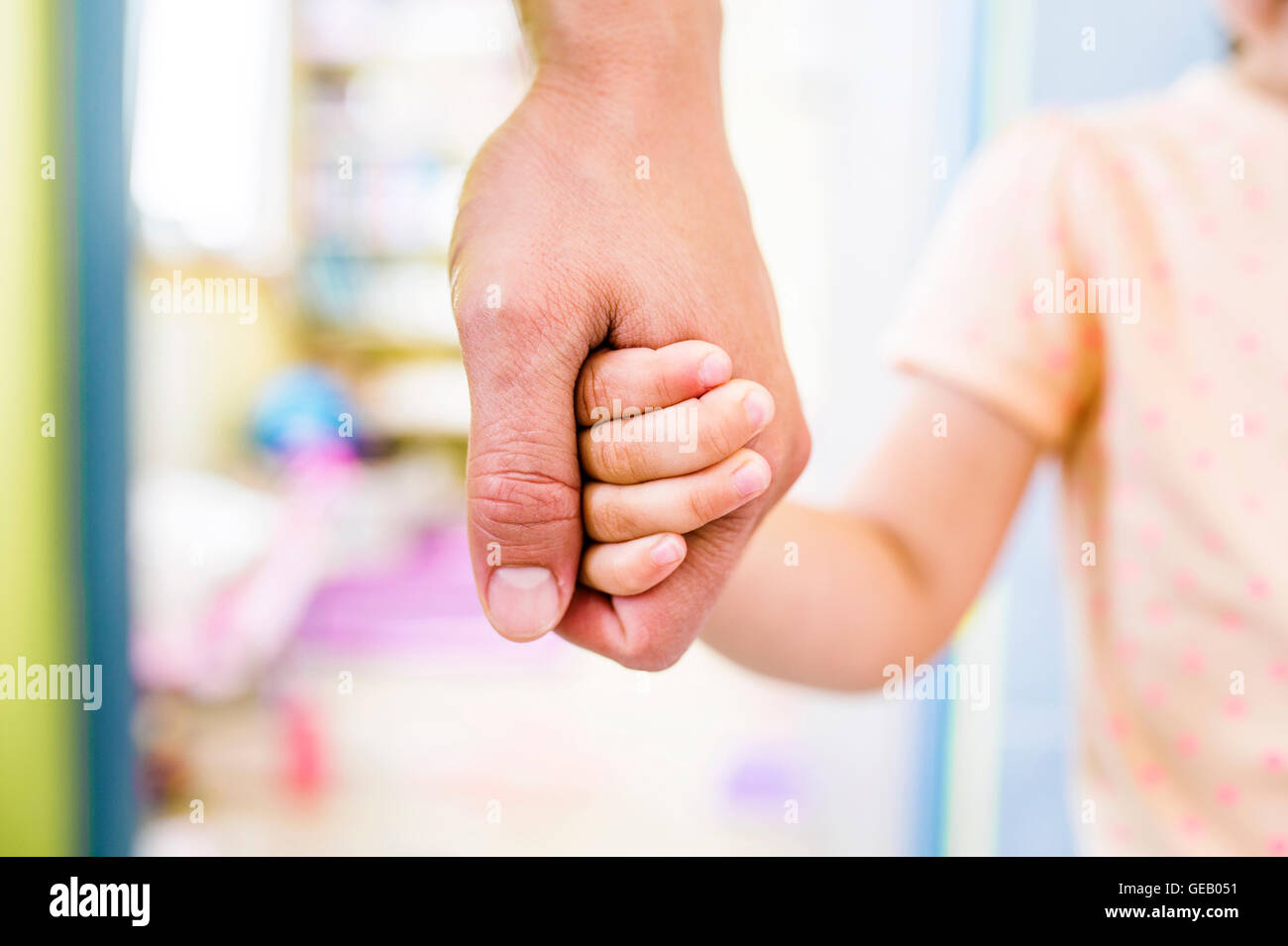 Father and daughter holding hands, close up Stock Photo - Alamy