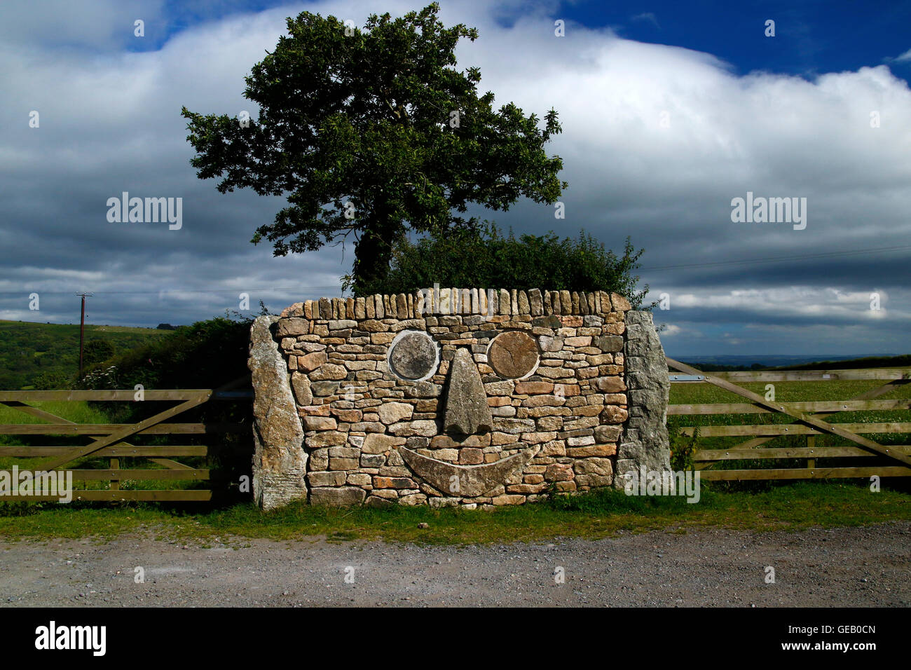 Widecombe's Dartmoor granite Smiley Face, built by local farmer Lloyd  Mortimore, he is a jolly character who is part of Dartmoor Stock Photo -  Alamy