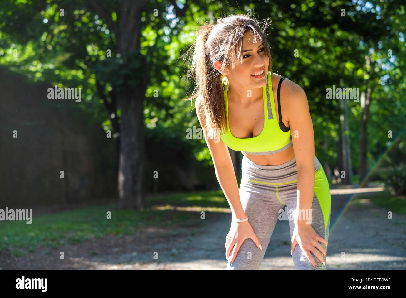 Young woman bending over resting hi-res stock photography and images ...
