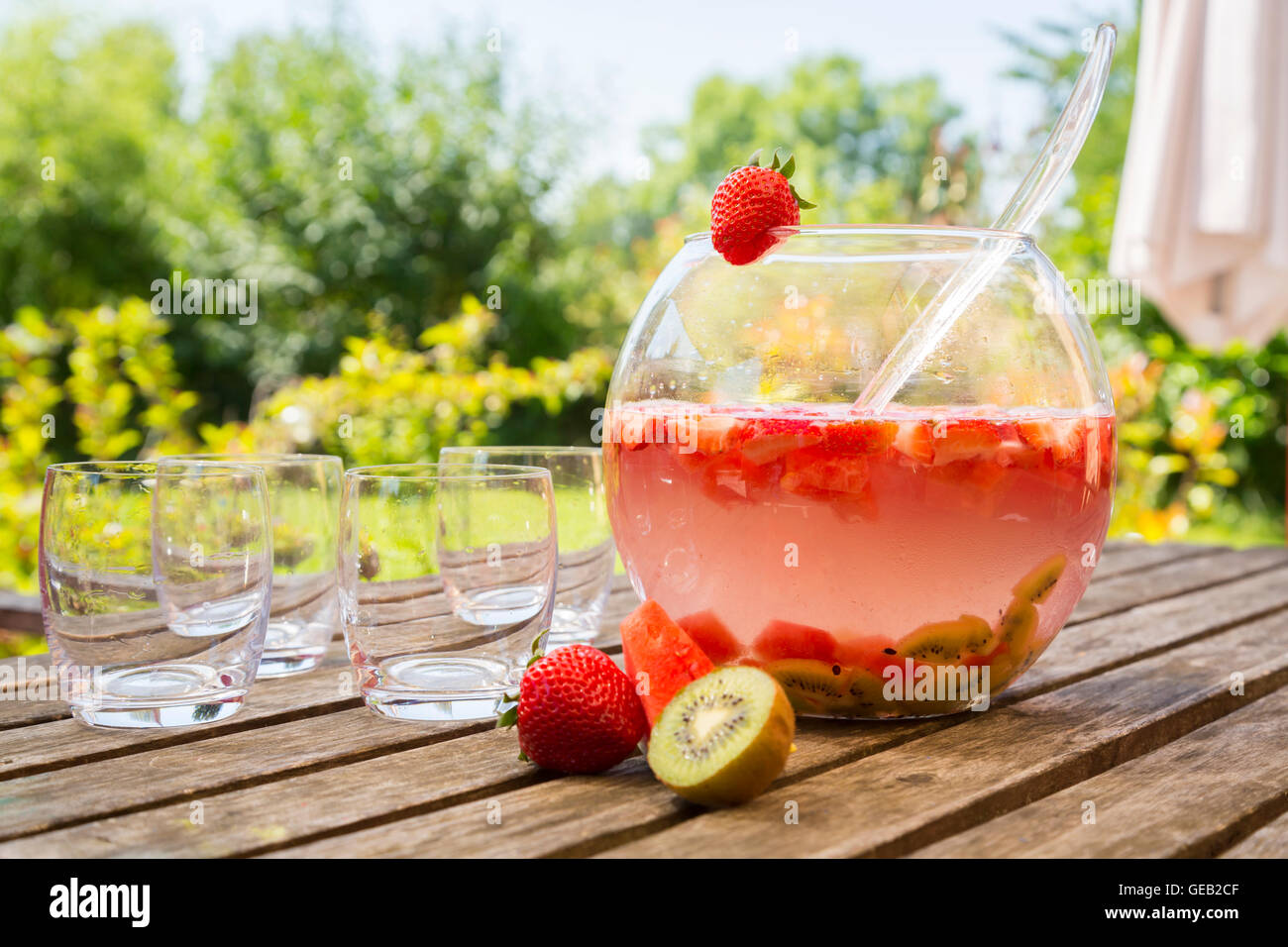 Watermelon strawberry kiwi bowle in garden Stock Photo - Alamy