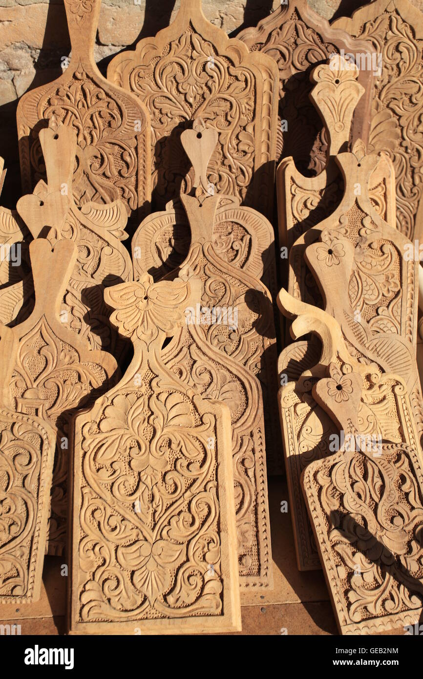 Example of traditional Uzbek woodcarving displayed in a carver's workshop. Stock Photo