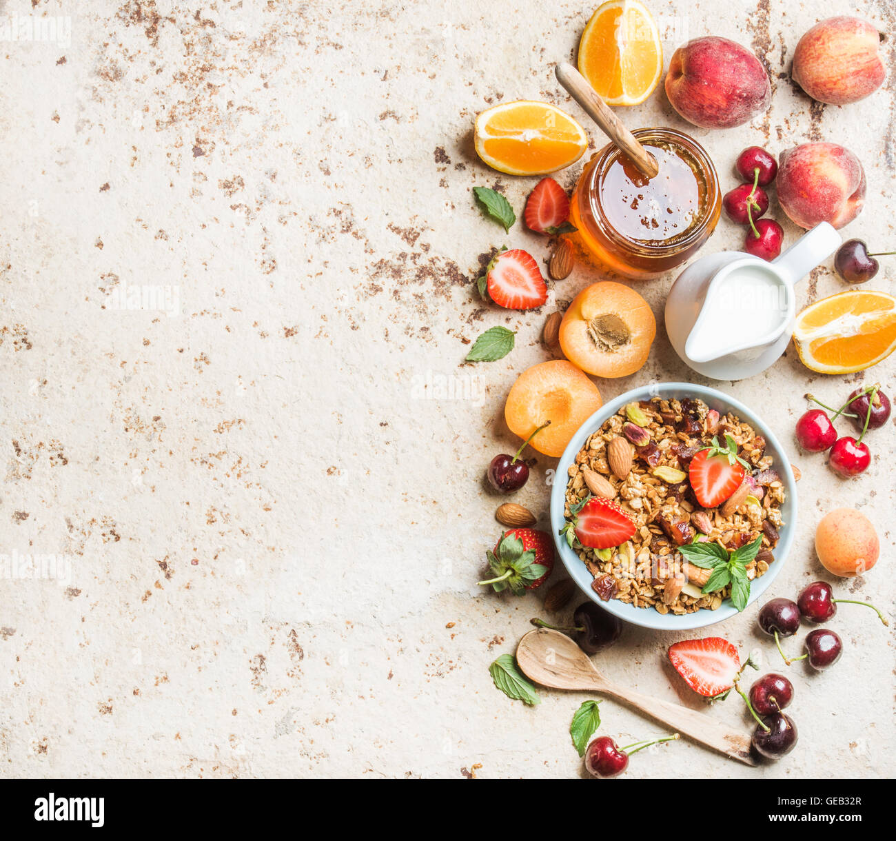 Healthy breakfast ingredients. Bowl of oat granola with milk, fresh