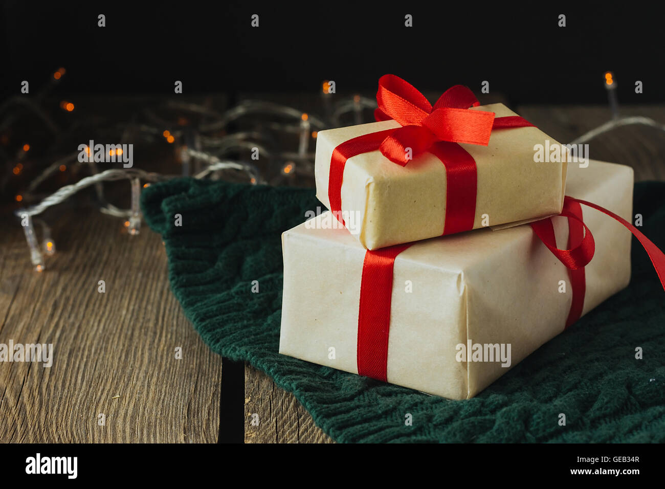 Christmas presents on green woolen pullover selective focus Stock Photo