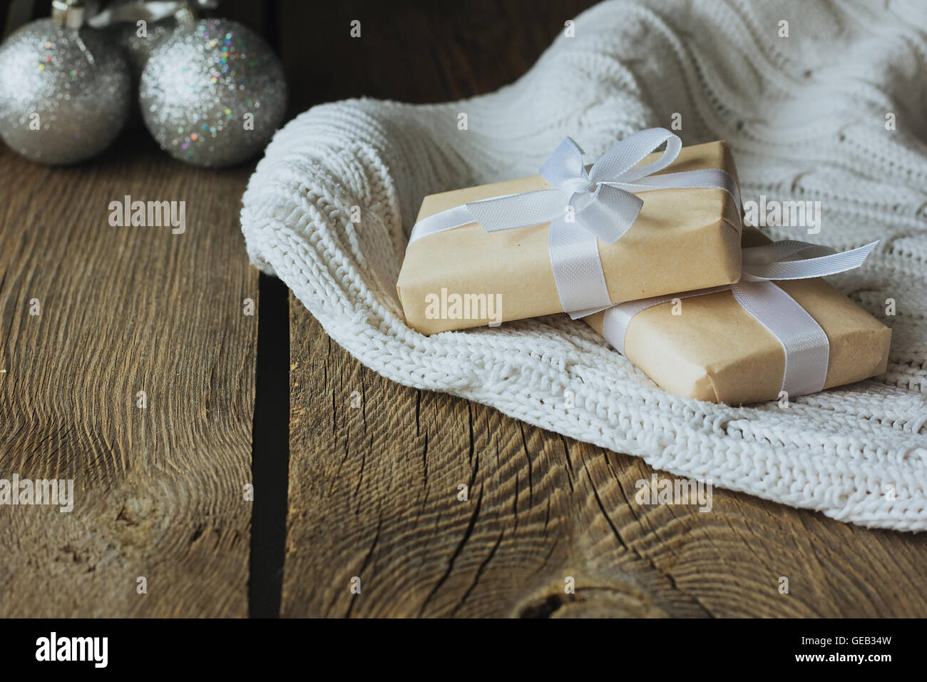 Christmas presents on white woolen pullover selective focus Stock Photo