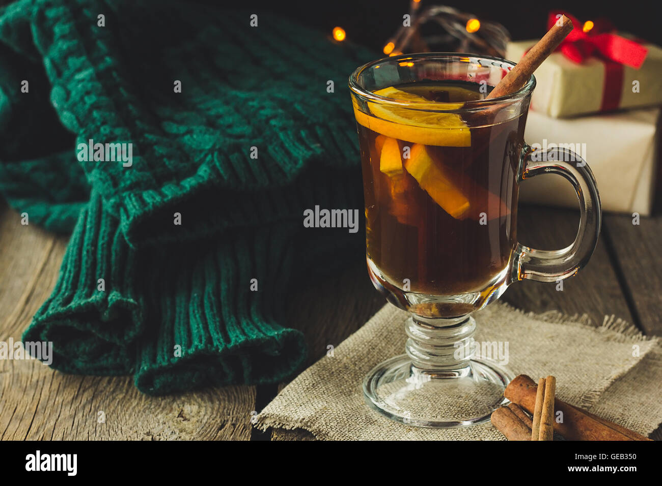 Glass of mulled wine and green pullover selective focus Stock Photo