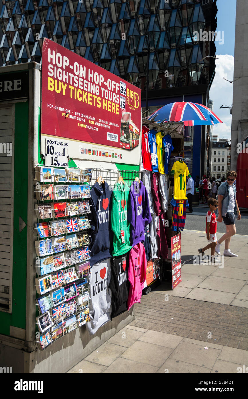 A street stall on Oxford street selling football strips, tourists trinkets, hats, scarves, and badges etc. Stock Photo