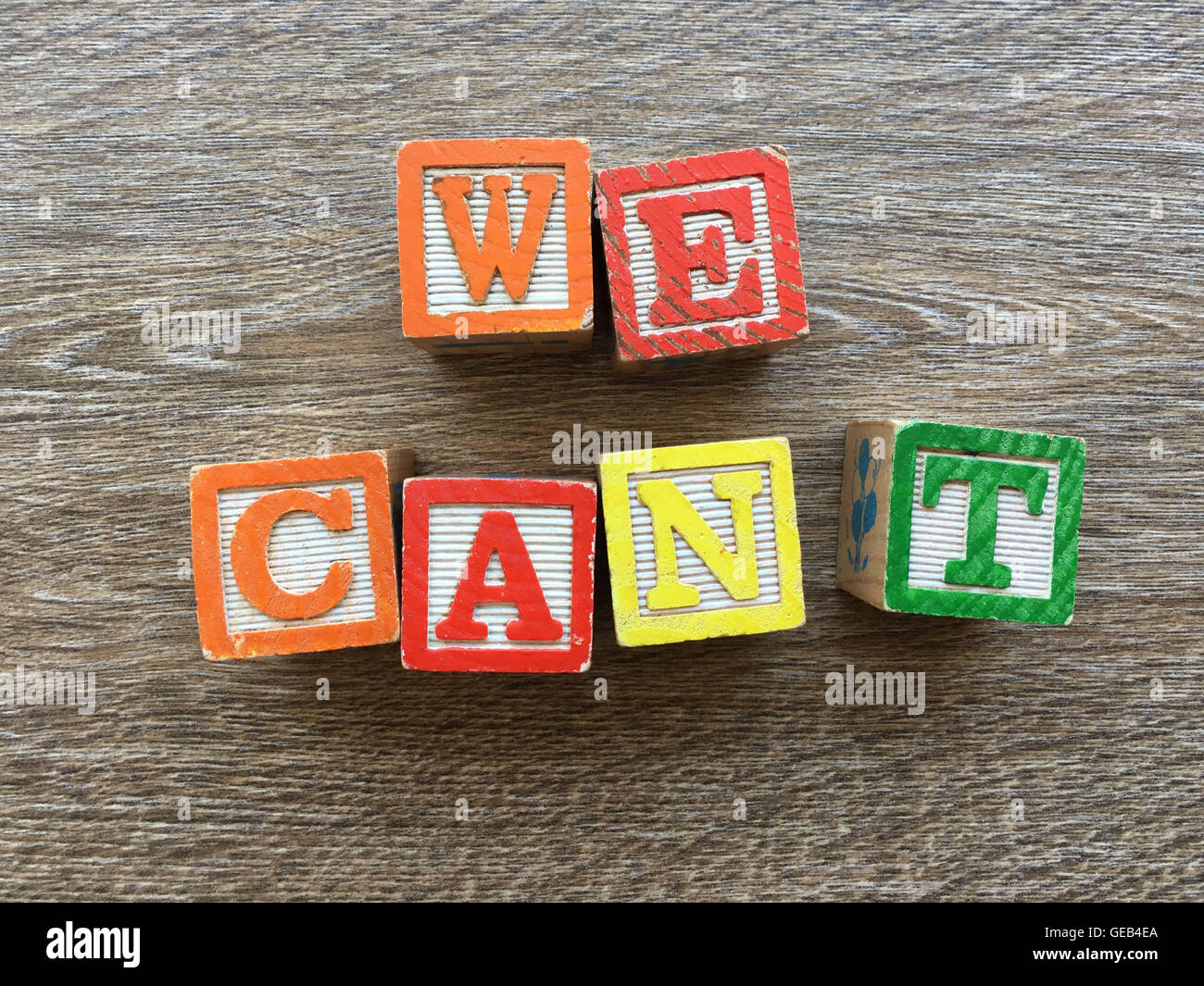 WE CAN'T sentence written with wood block letter characters Stock Photo