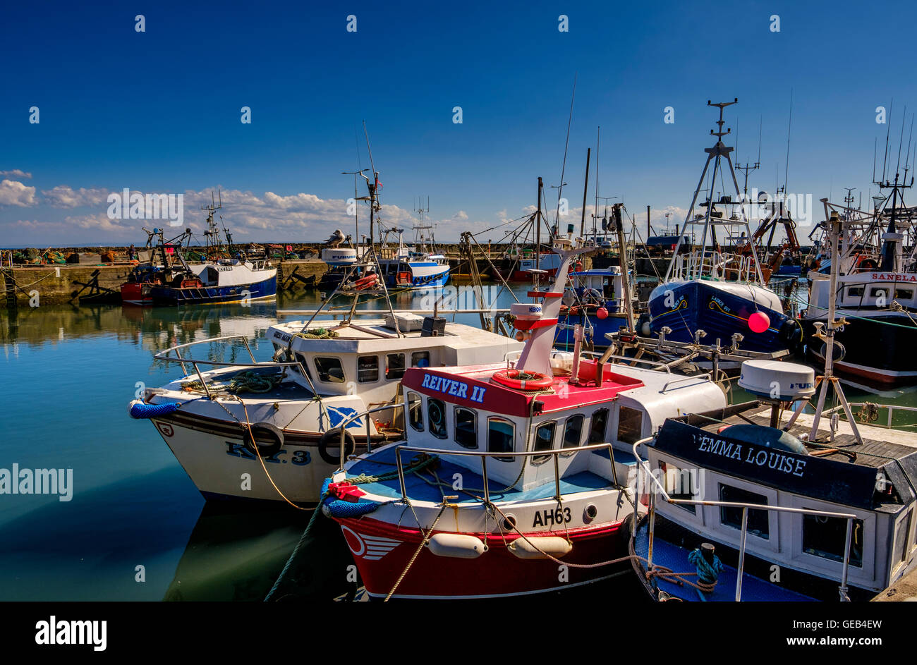 Fishing boats tied up in the harbour at Pittenweem, Fife Stock Photo ...