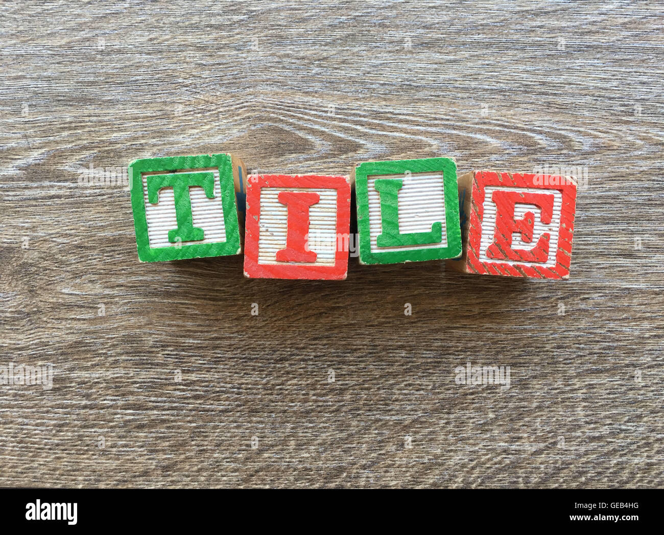 Alphabet wood block letters forming the word TILE, combining those toys