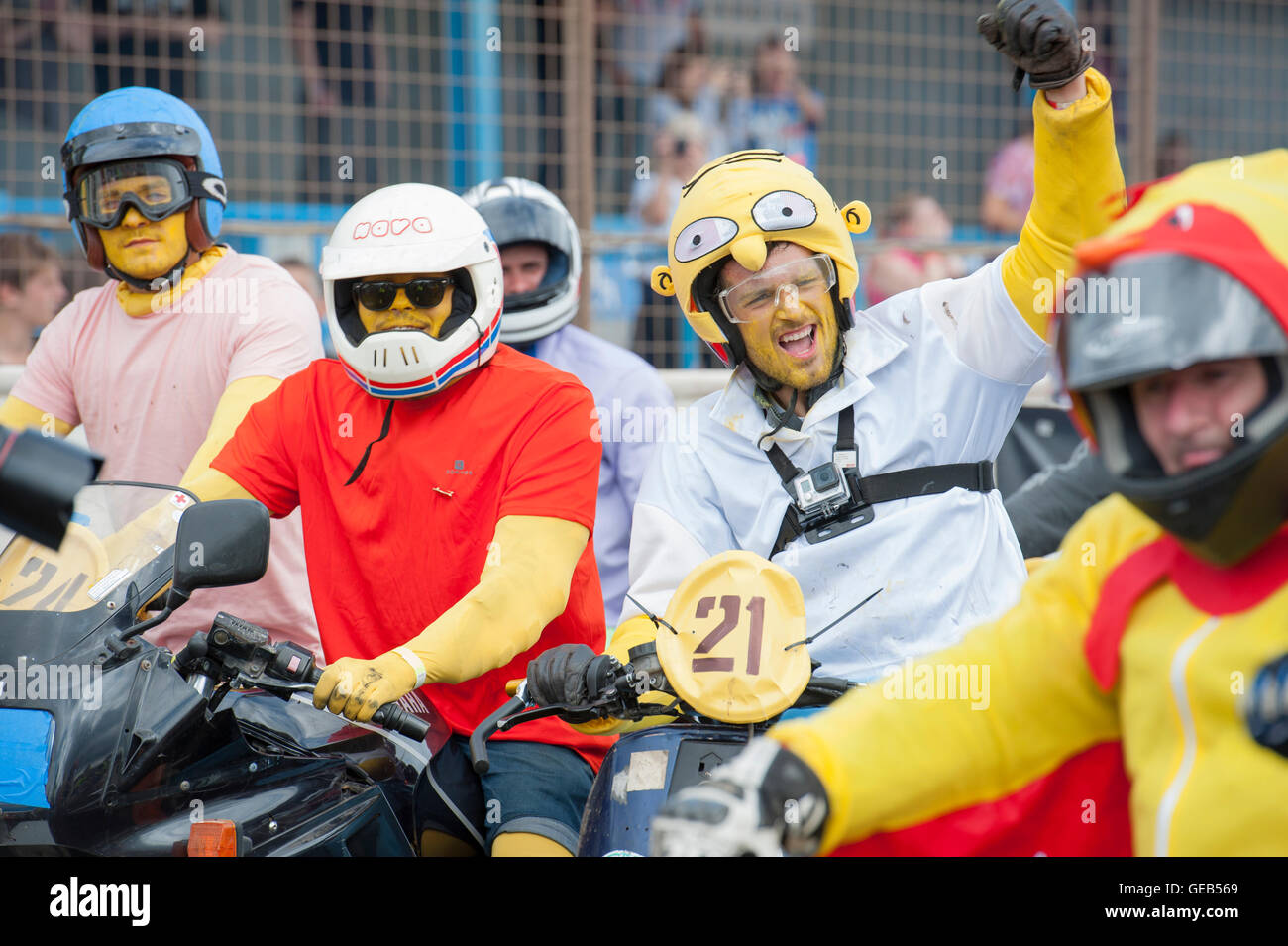 Kings Lynn, Norfolk, United Kingdom. 16.07.2016. Fifth annual Dirt Quake festival with Guy Martin and Carl 'Foggy' Fogarty. Pictured is a racer dressed as Homer Simpson riding a Vespa scooter. Stock Photo