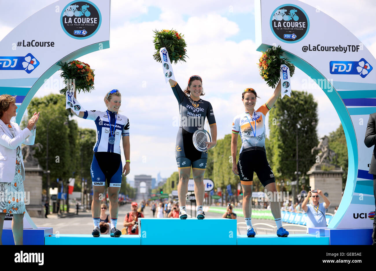 (left to right) Second place Lotta Lepisto, winner Chloe Hosking and third place Marianne Vos celebrate on the podium after La Course by Le Tour de France in Paris, France. Stock Photo