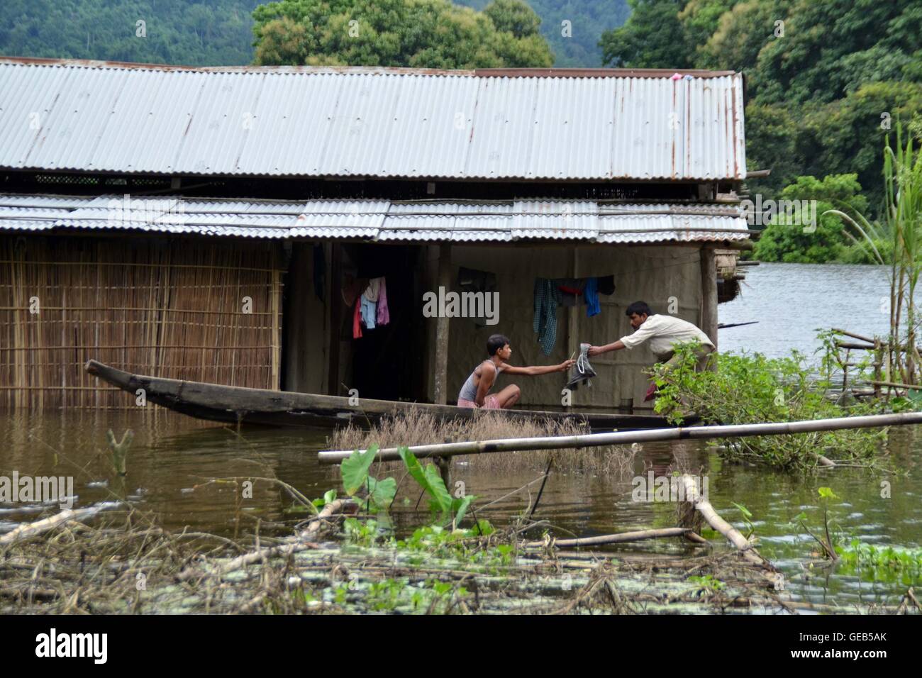 Flood victims moves towards the highland from their flood affected houses  at Kothari village in Nagaon district of Assam, India toady due to flood. (Photo by Simanta Talukdar / Pacific Press) Stock Photo