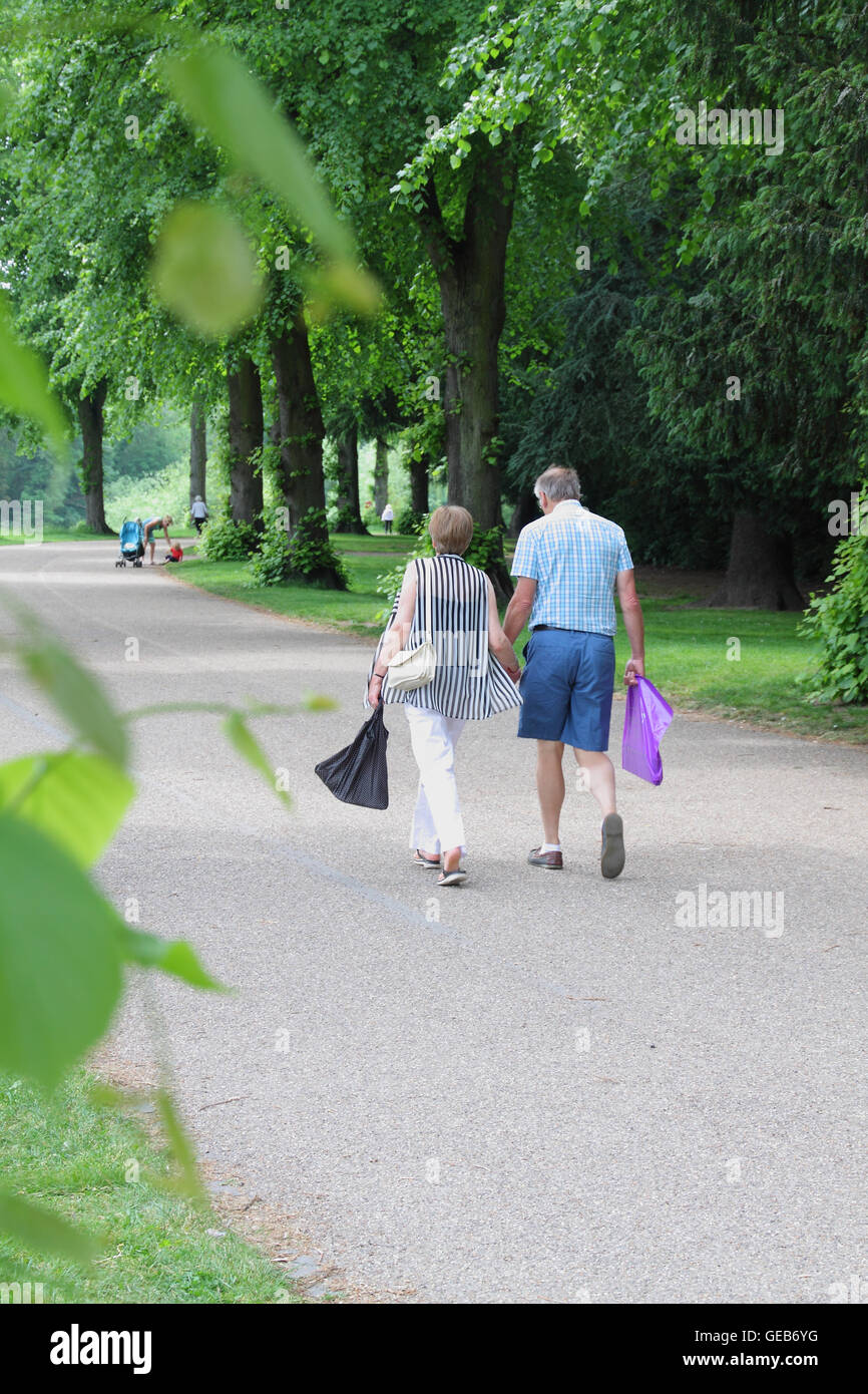 Middle-aged couple taking a riverside walk in Shrewsbury, Shropshire, England Stock Photo