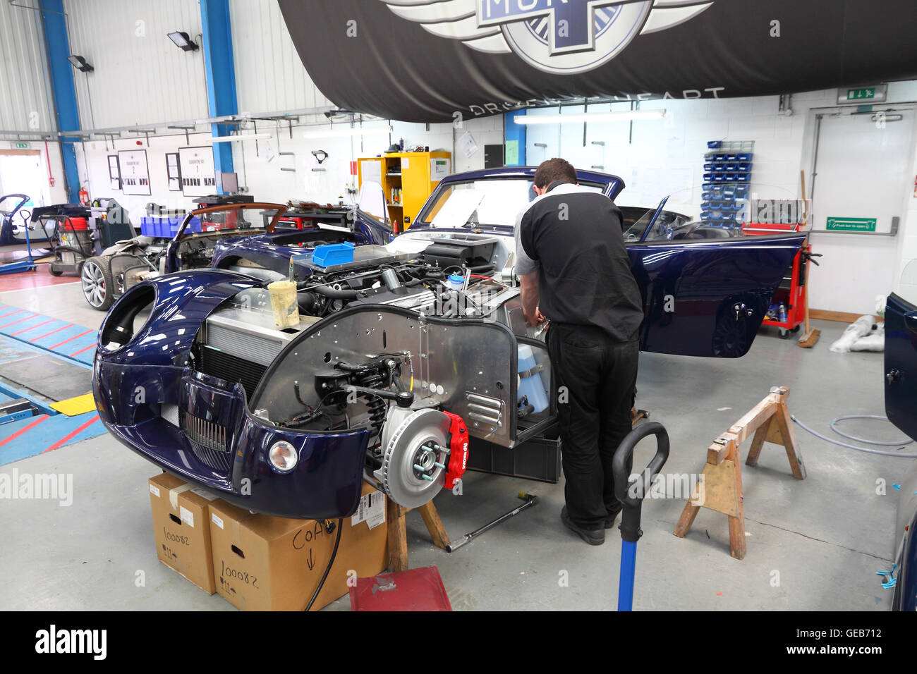 Mechanic assembling a Morgan Aero 8 sportscar at Morgan's Malvern factory, England. Stock Photo