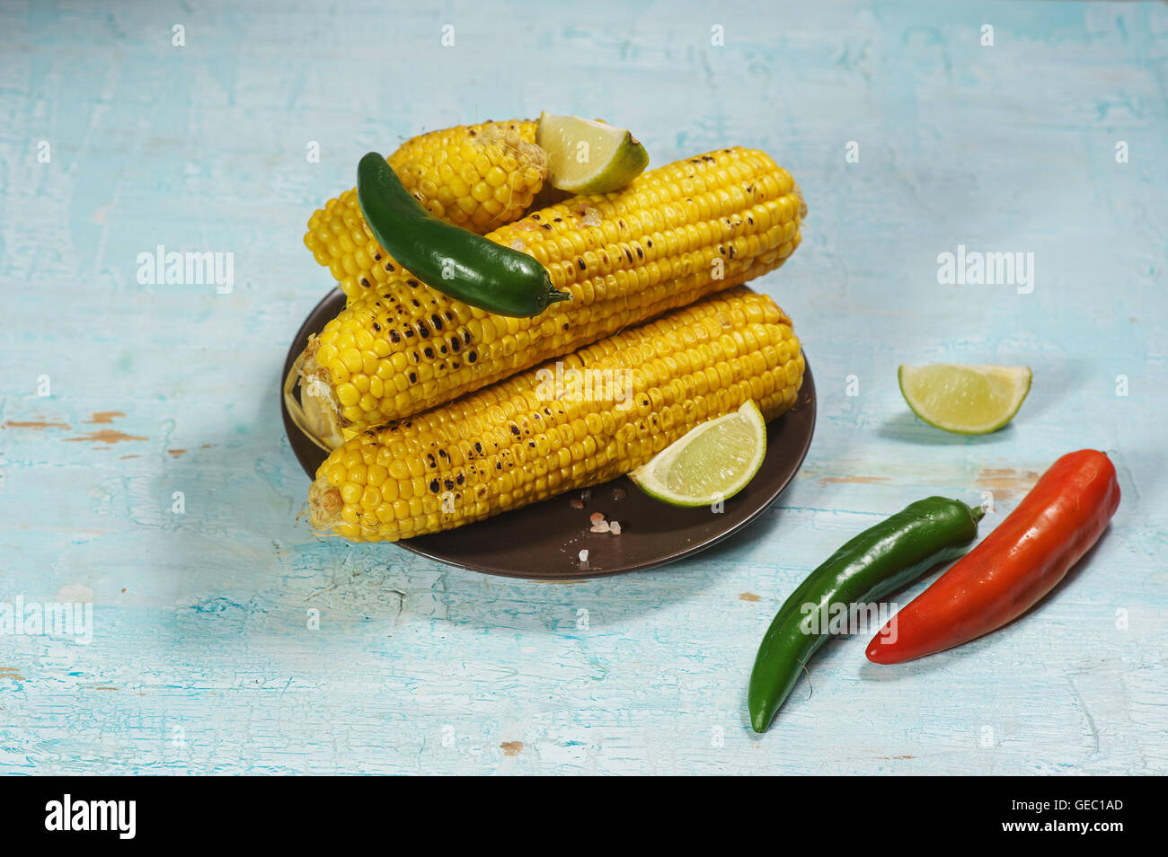 Cooked corn cobs on blue table in mexican style Stock Photo Alamy