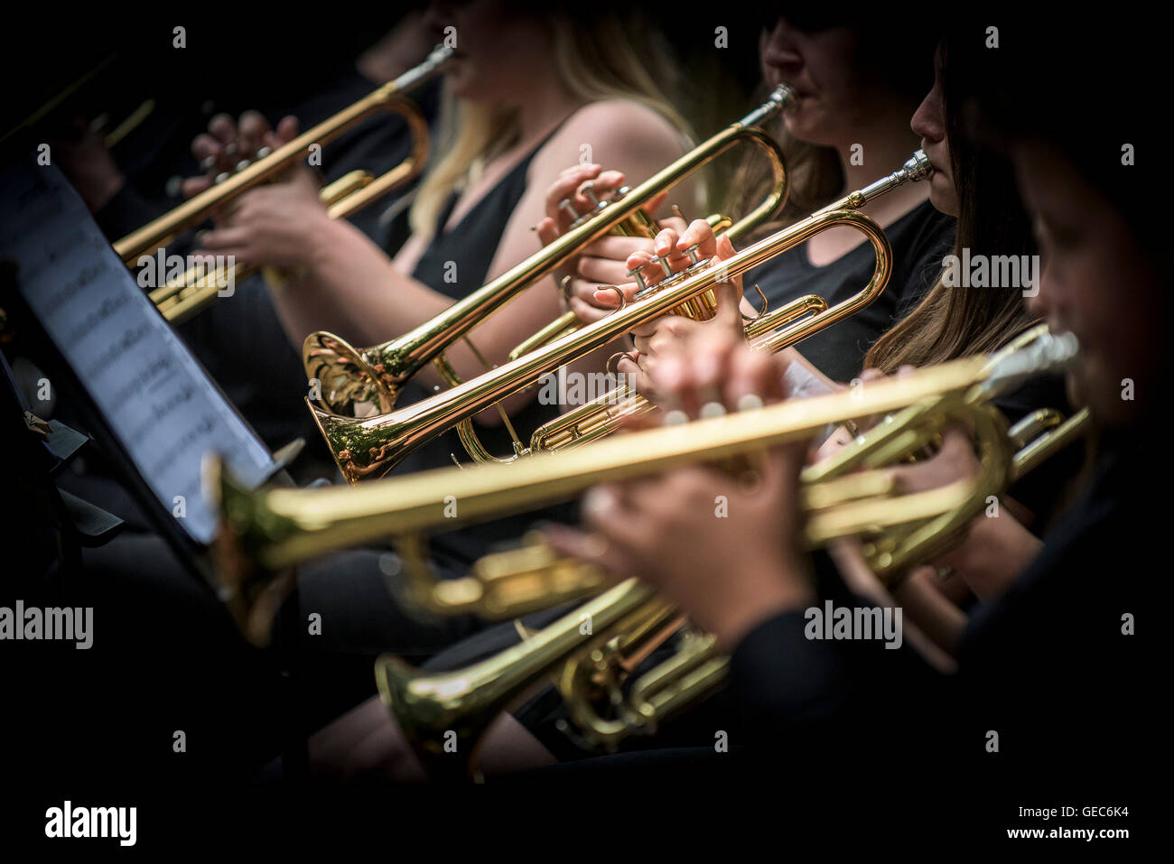 Trumpet players in a jazz band perform at Trebah Gardens amphitheatre in Cornwall. Stock Photo