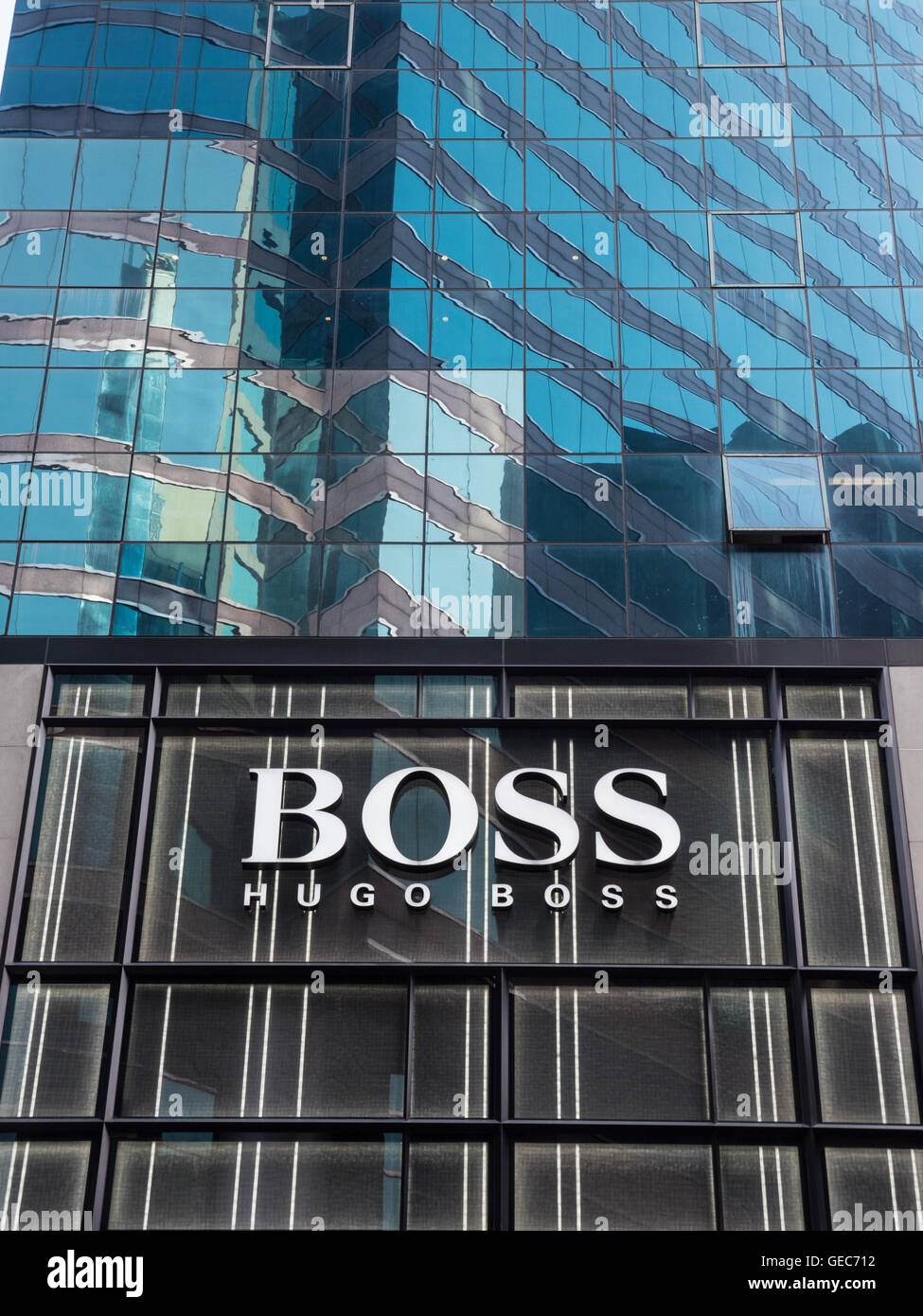 Hugo Boss designer shop sign on high rise glass clad building in ...