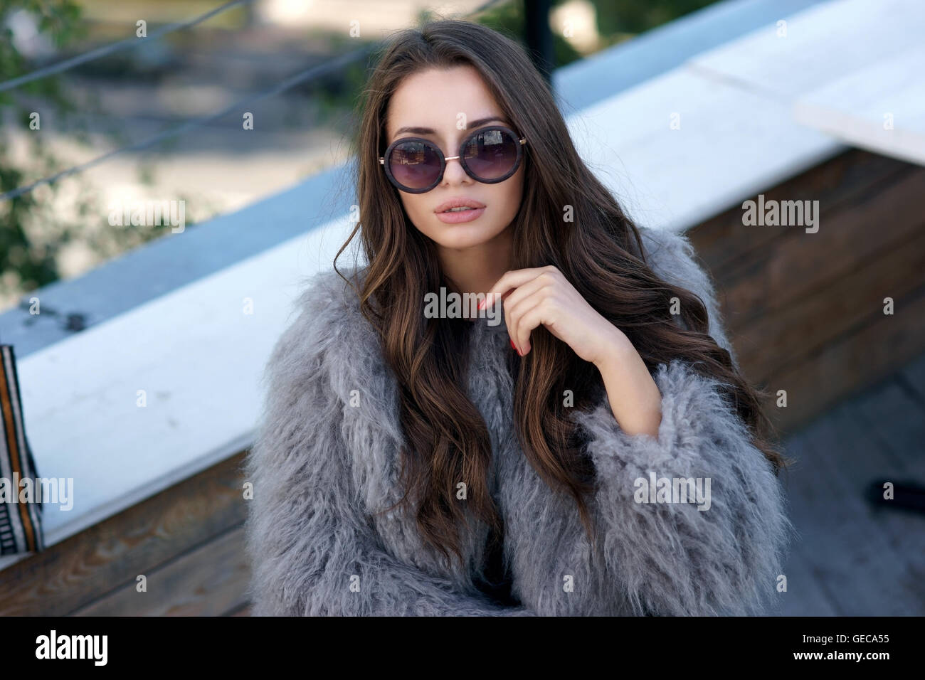 trendy girl in fur coat Stock Photo - Alamy