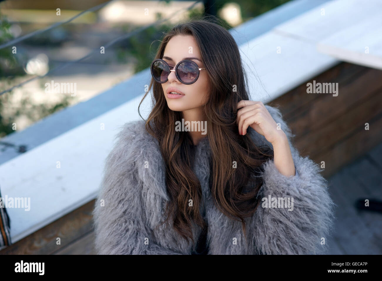 trendy girl in fur coat Stock Photo - Alamy