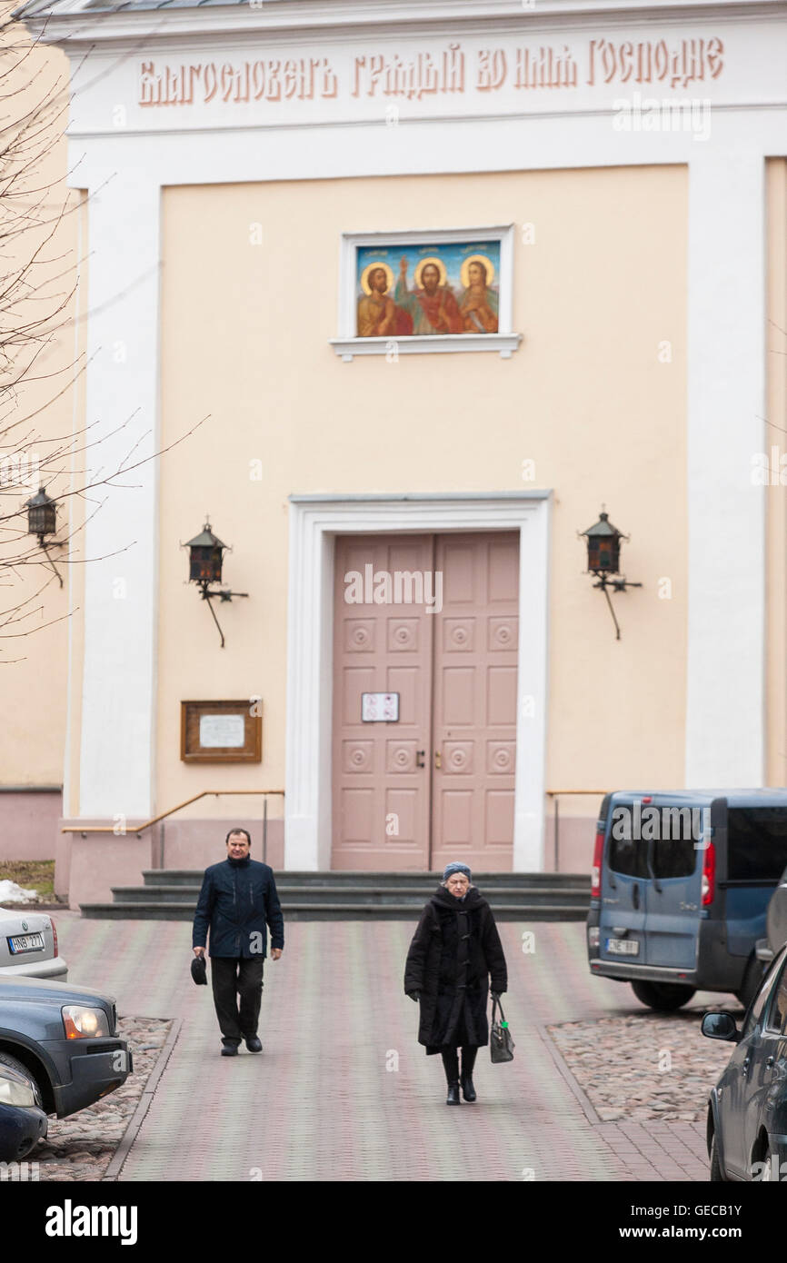 Priests walk from a seminary in Riga, the capital city of Latvia, in ...