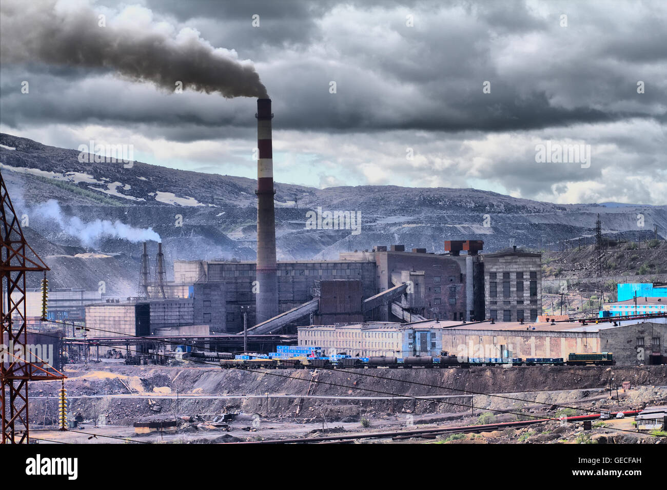 Grim picture of human activity. Catastrophic pollution of atmosphere and transformation of the Earth's surface. Copper-Nickel mi Stock Photo