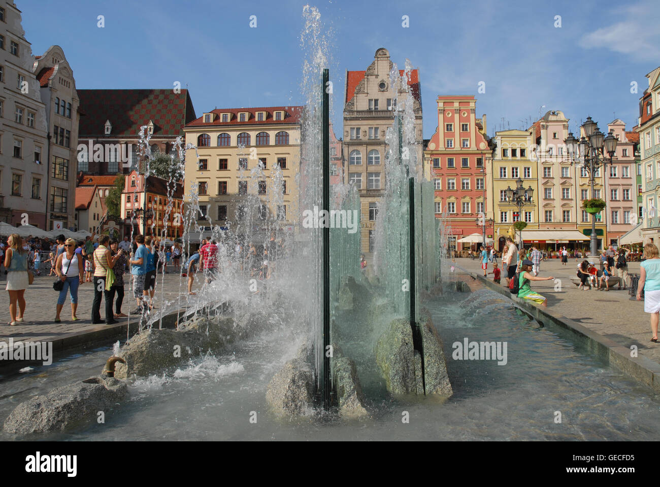 Water fountain in the Market Square (Rynek) on a hot summer's day, Wroclaw, Silesia, Poland. Stock Photo