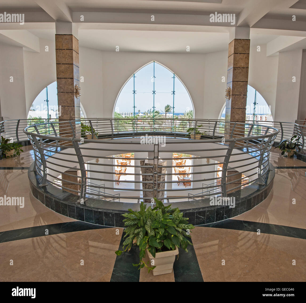 Interior design architecture of atrium lobby area in luxury tropical resort hotel with large panoramic window Stock Photo