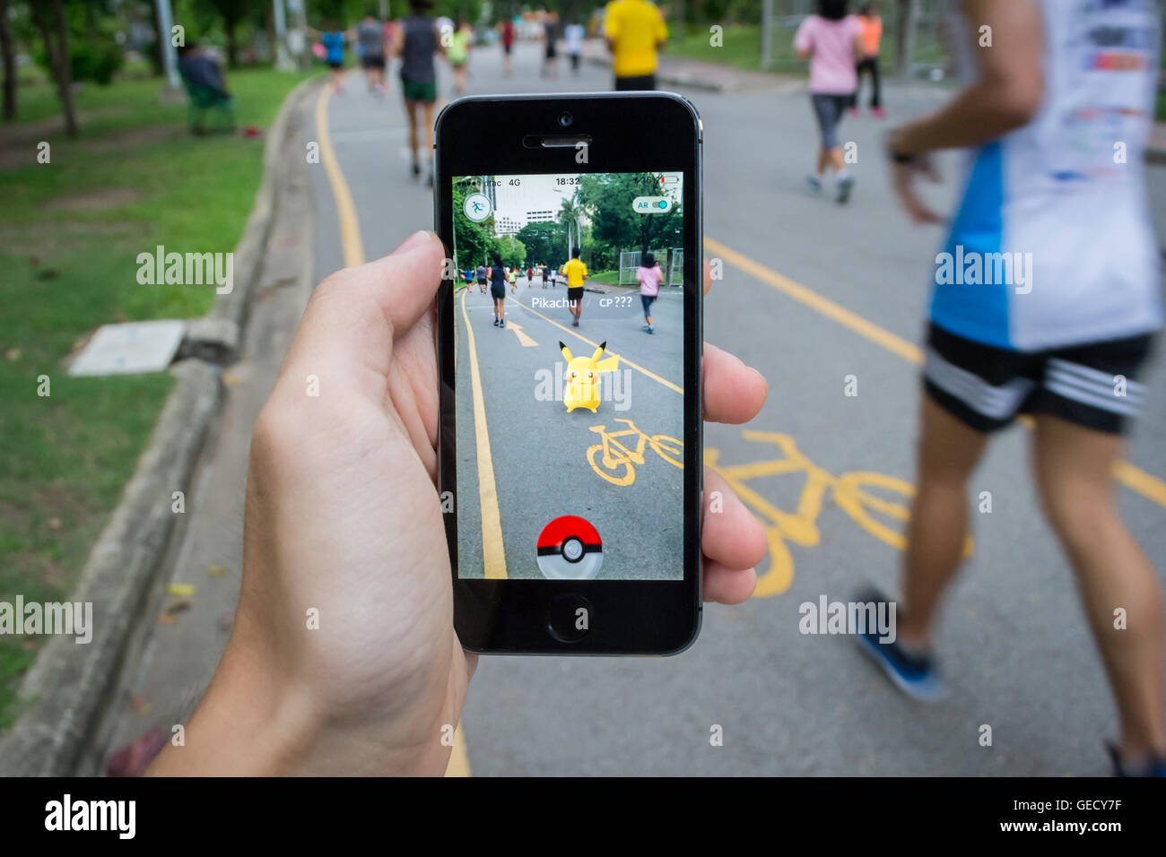 BANGKOK, Thailand - August 7, 2016: An IPhone User Playing Pokemon Go Game  In Supermarket Of Department Store And Find Pokemon Monster For Catching.  Free-to-play Augmented Reality Mobile Game Developed By Niantic.