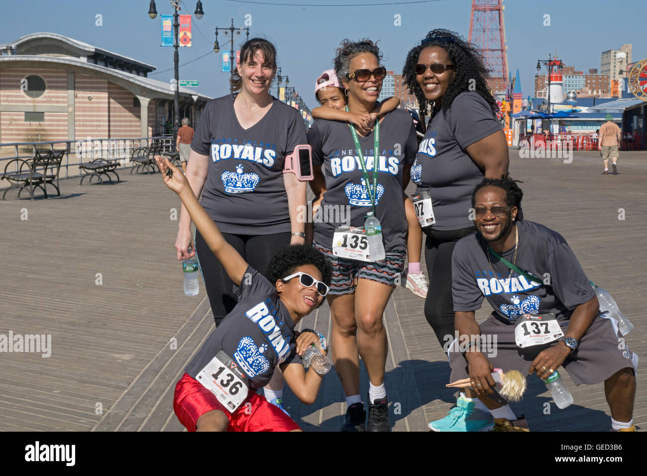 Men & women from a book club in New Jersey pose for a photo during the Brooklyn Cyclones 5k race in Coney Island, Brooklyn, NYC Stock Photo