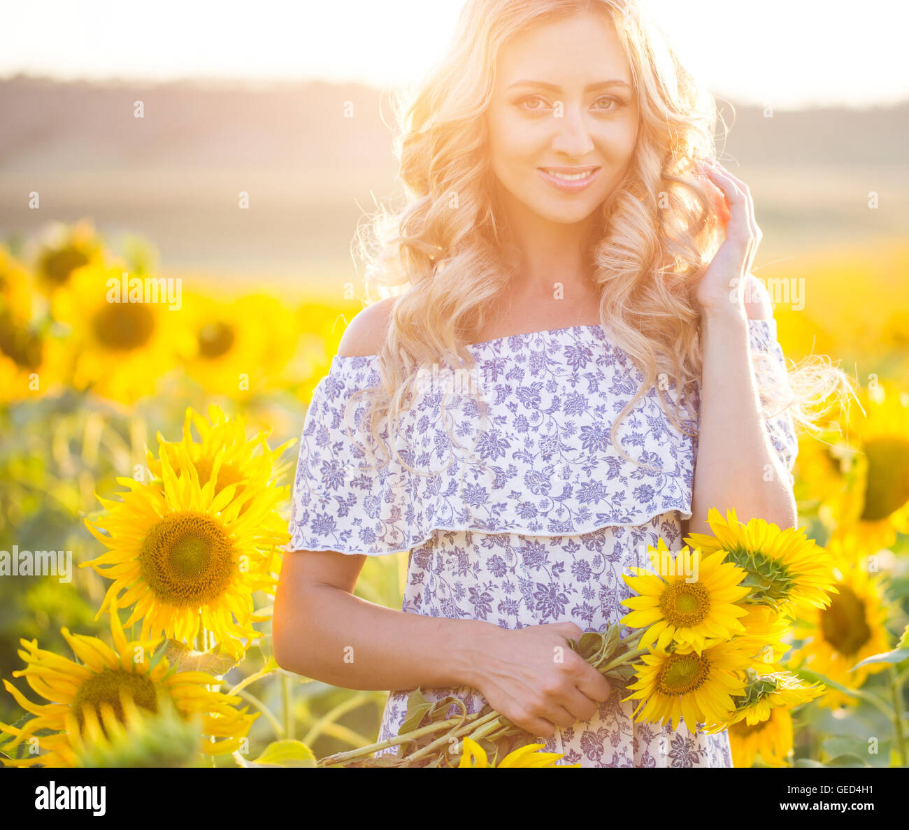 Portrait of the beautiful girl with a sunflowers Stock Photo - Alamy