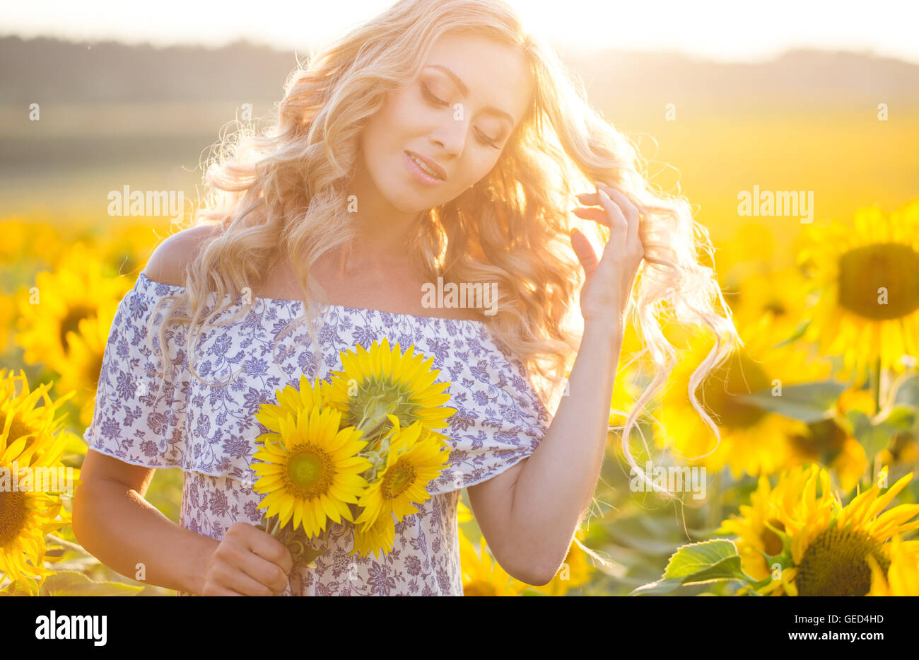Portrait of the beautiful girl with a sunflowers Stock Photo - Alamy