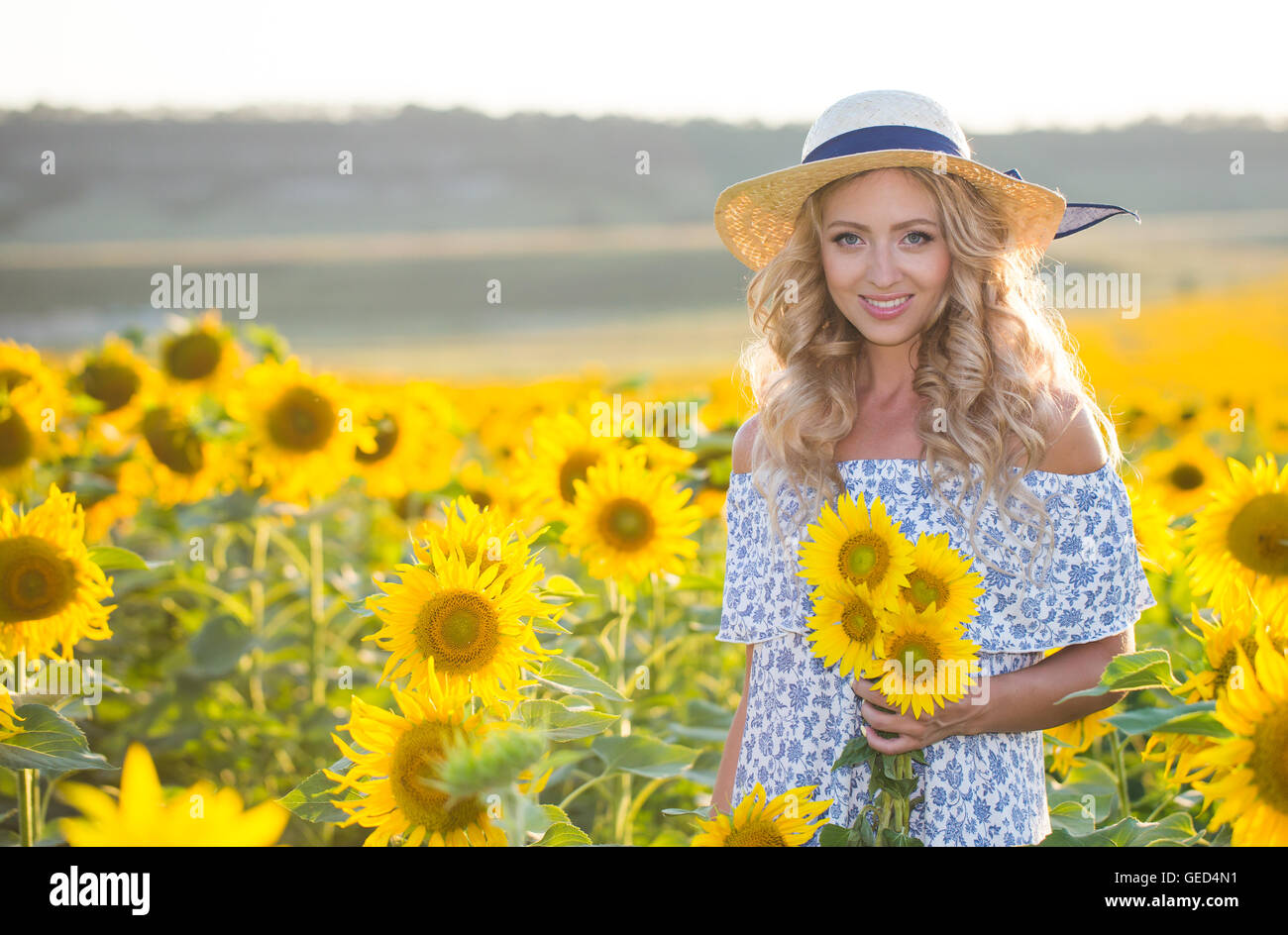 Portrait of the beautiful girl with a sunflowers Stock Photo - Alamy