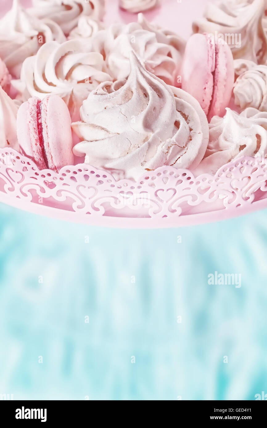 Retro toned homemade meringues on a plate, space for text. Stock Photo