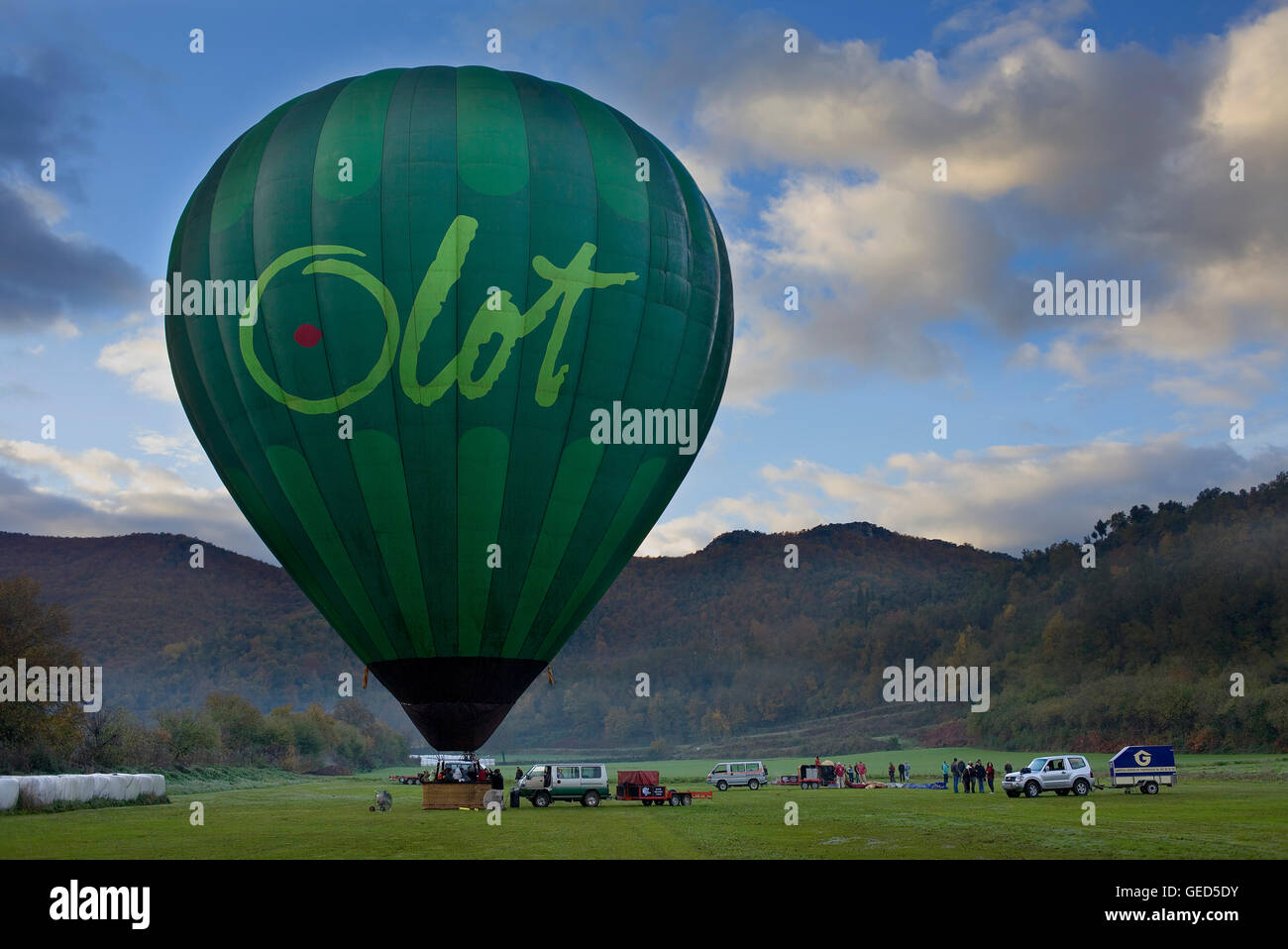 Hot air balloon preparing for flight over Garrotxa Natural Park,Girona province. Catalonia. Spain Stock Photo
