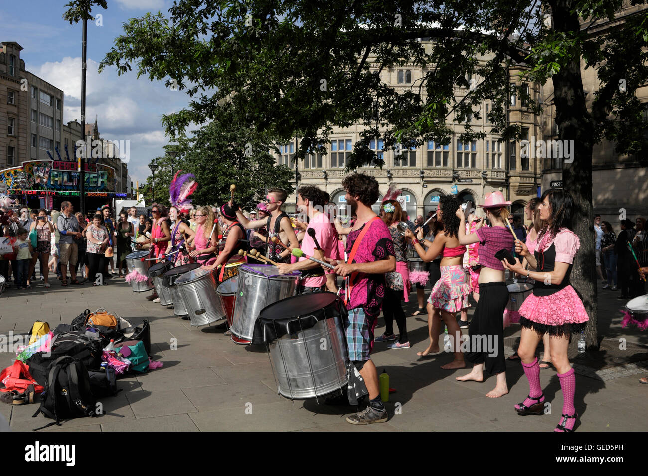 Group of players drumming entertaining the crowds at Sheffield city centre Tramlines Festival England 2016 Stock Photo