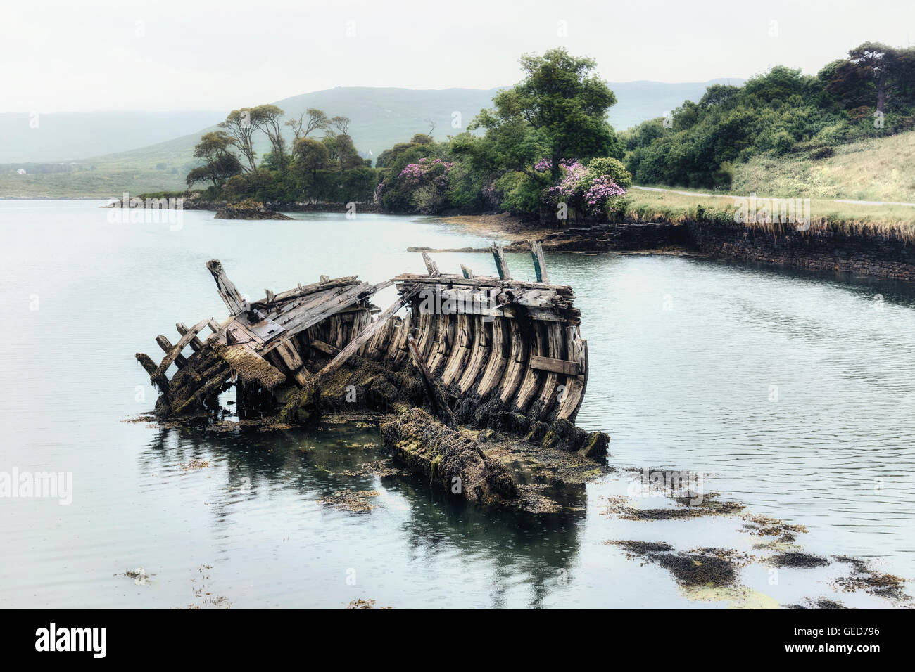 an old ship wreck in the sea Stock Photo