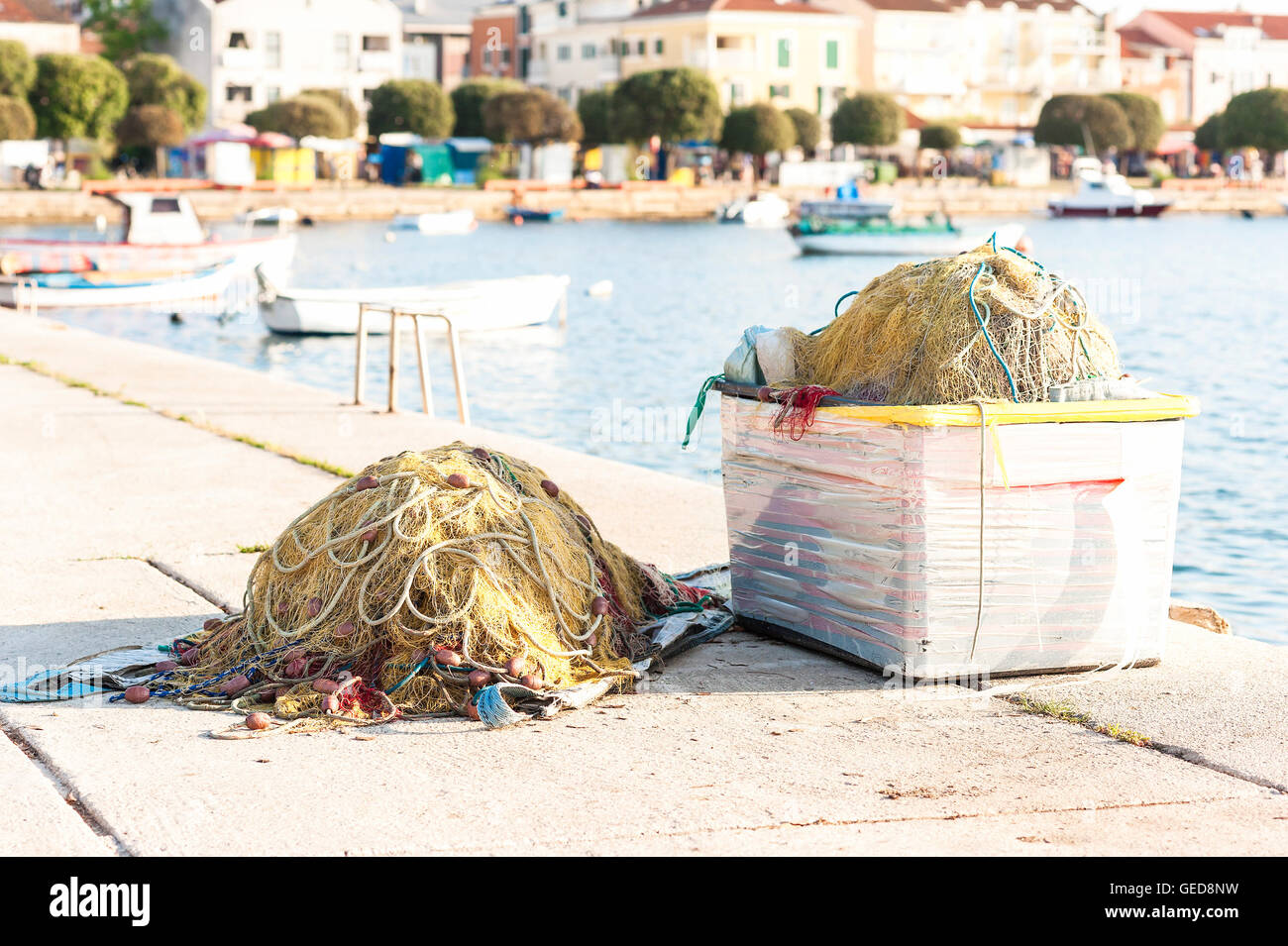 A large fishing net piled on the dock Stock Photo
