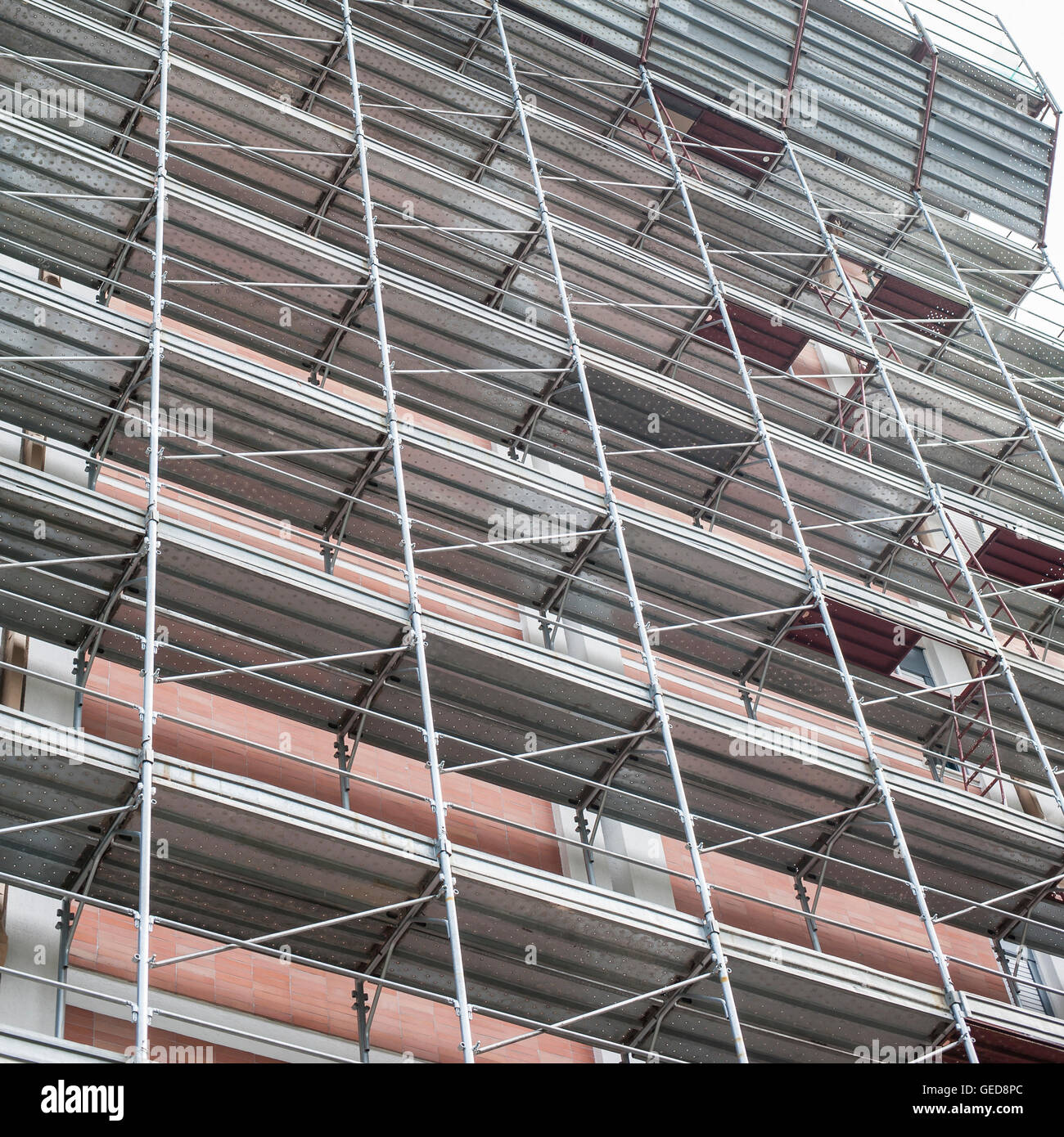House for renovation with the scaffolding for bricklayers Stock Photo