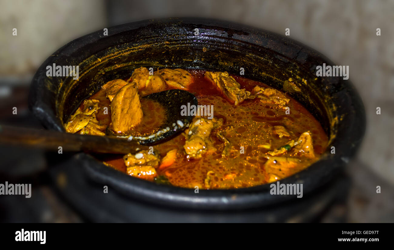 Spicy chicken curry in a traditional pot Stock Photo
