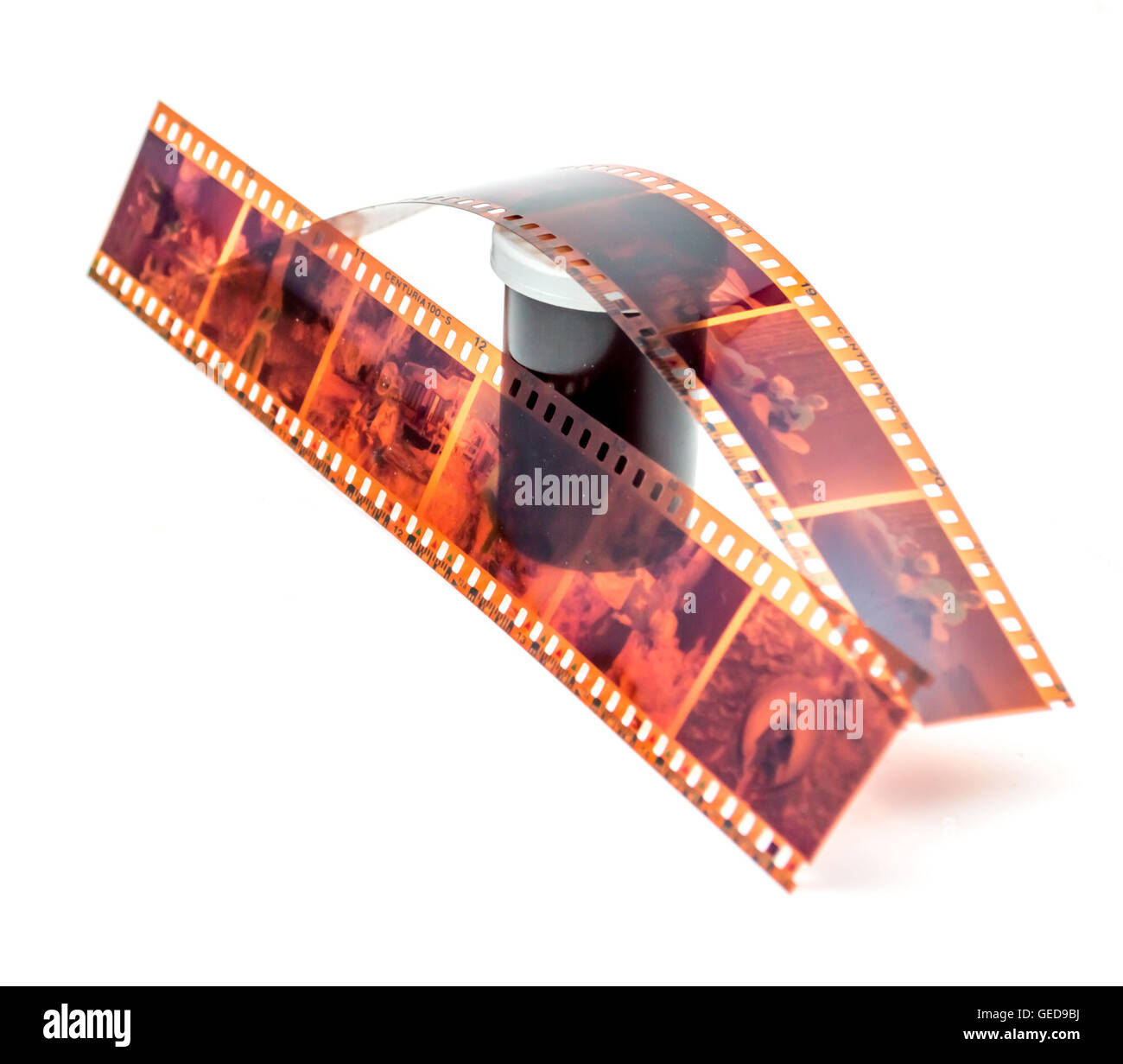 35mm film negative and roll container on white background Stock Photo