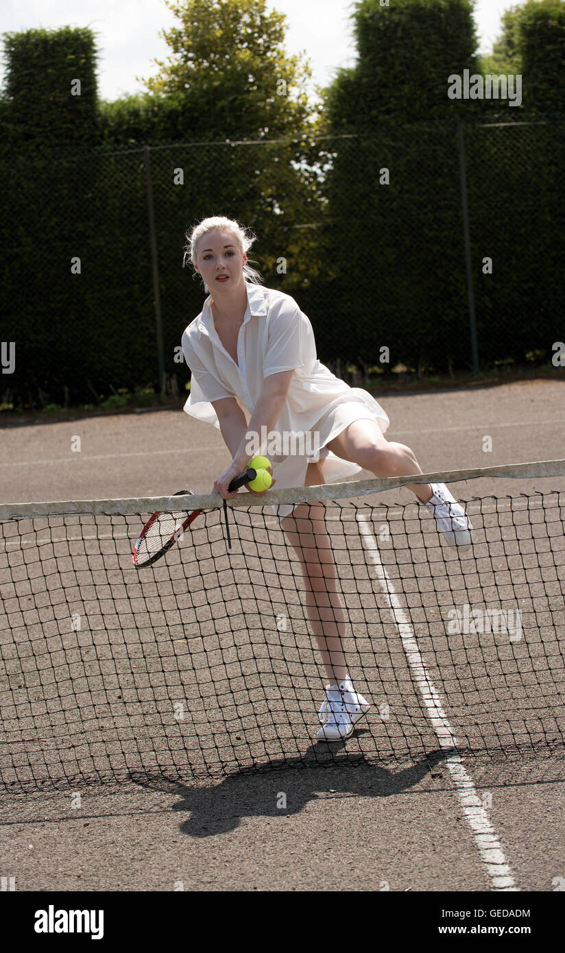 PORTRAIT OF A YOUNG TENNIS PLAYER. A young female tennis player with