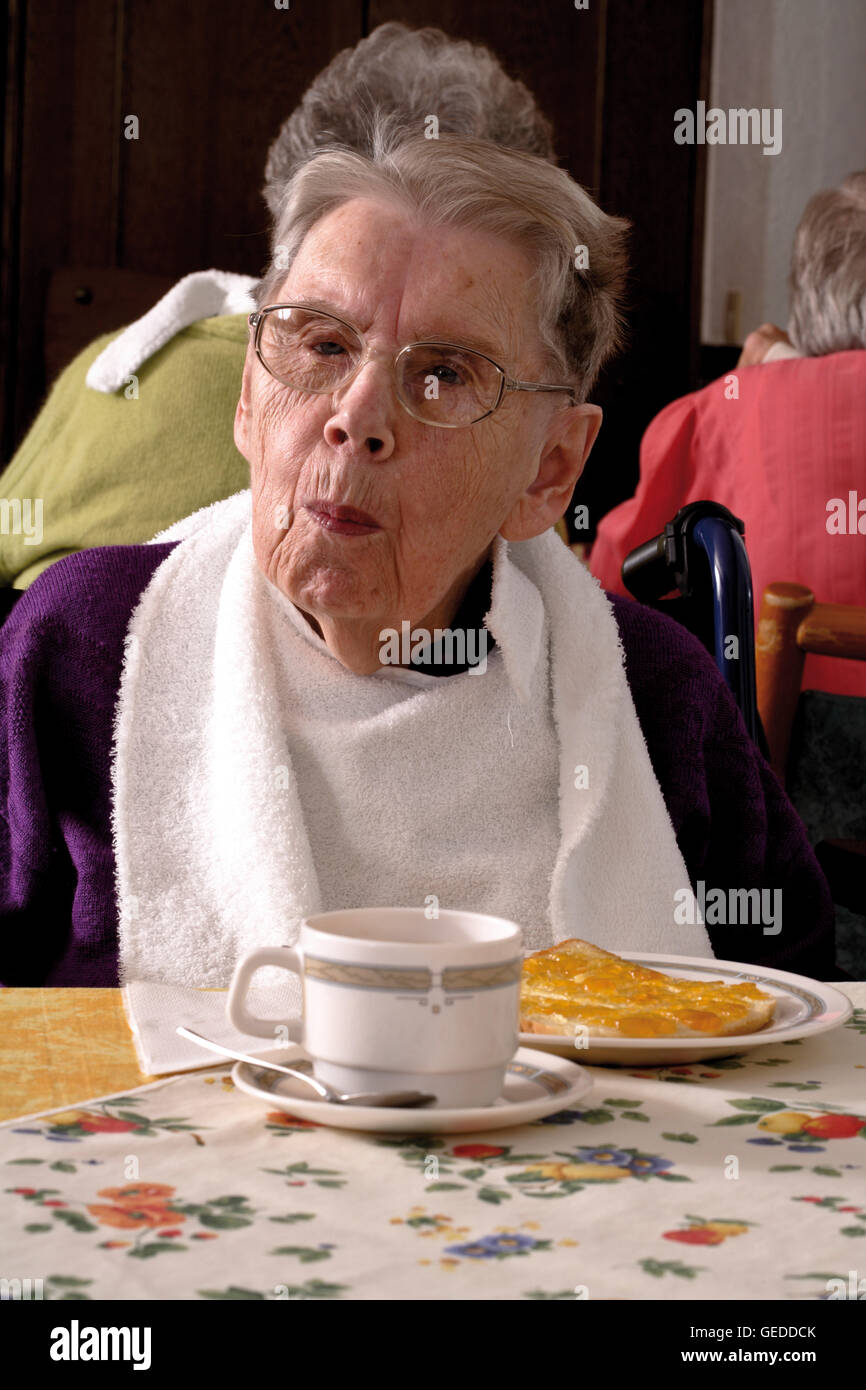 Senior citizen enjoying afternoon tea at an old-age home Stock Photo