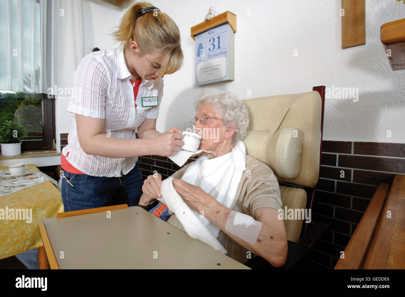 Nurse feeding resident of a nursing home Stock Photo