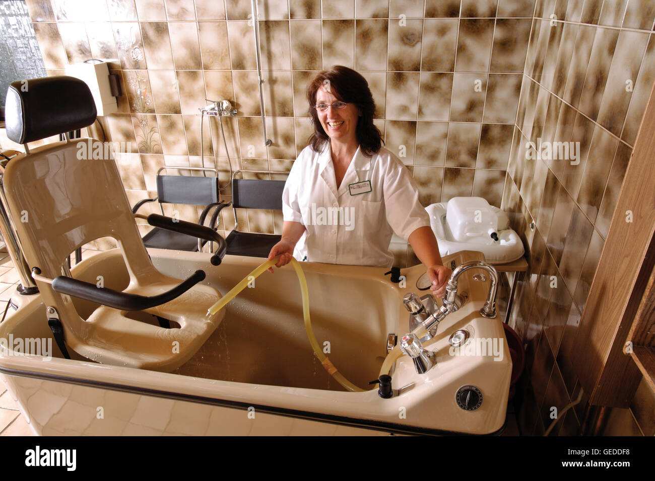 Nurse in a handicapped accessible bathroom at a nursing home Stock Photo